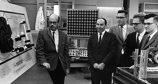 Five of the eight scientists who helped UVic become a founding partner in TRIUMF