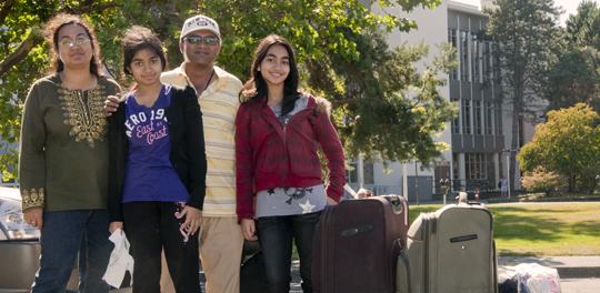 Student moving into residence with help from her family