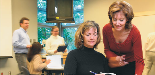 Nursing professor and 3M Teaching Fellow Dr. Gweneth Doane (far right) and former PhD student Lorelei Newton.