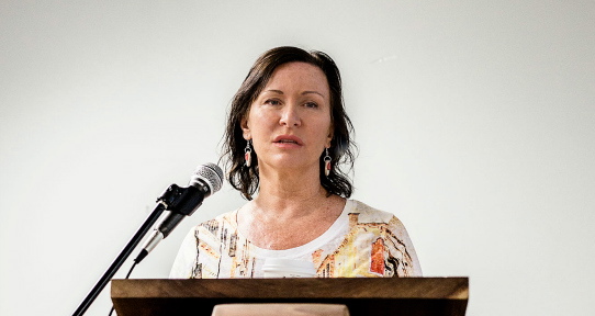 Dr. Charlotte Loppie giving a presentation on the TRC Calls to Action