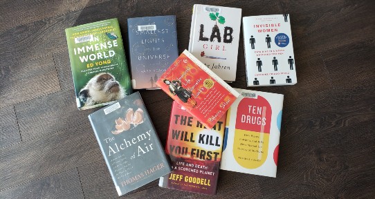 8 books scattered across the floor