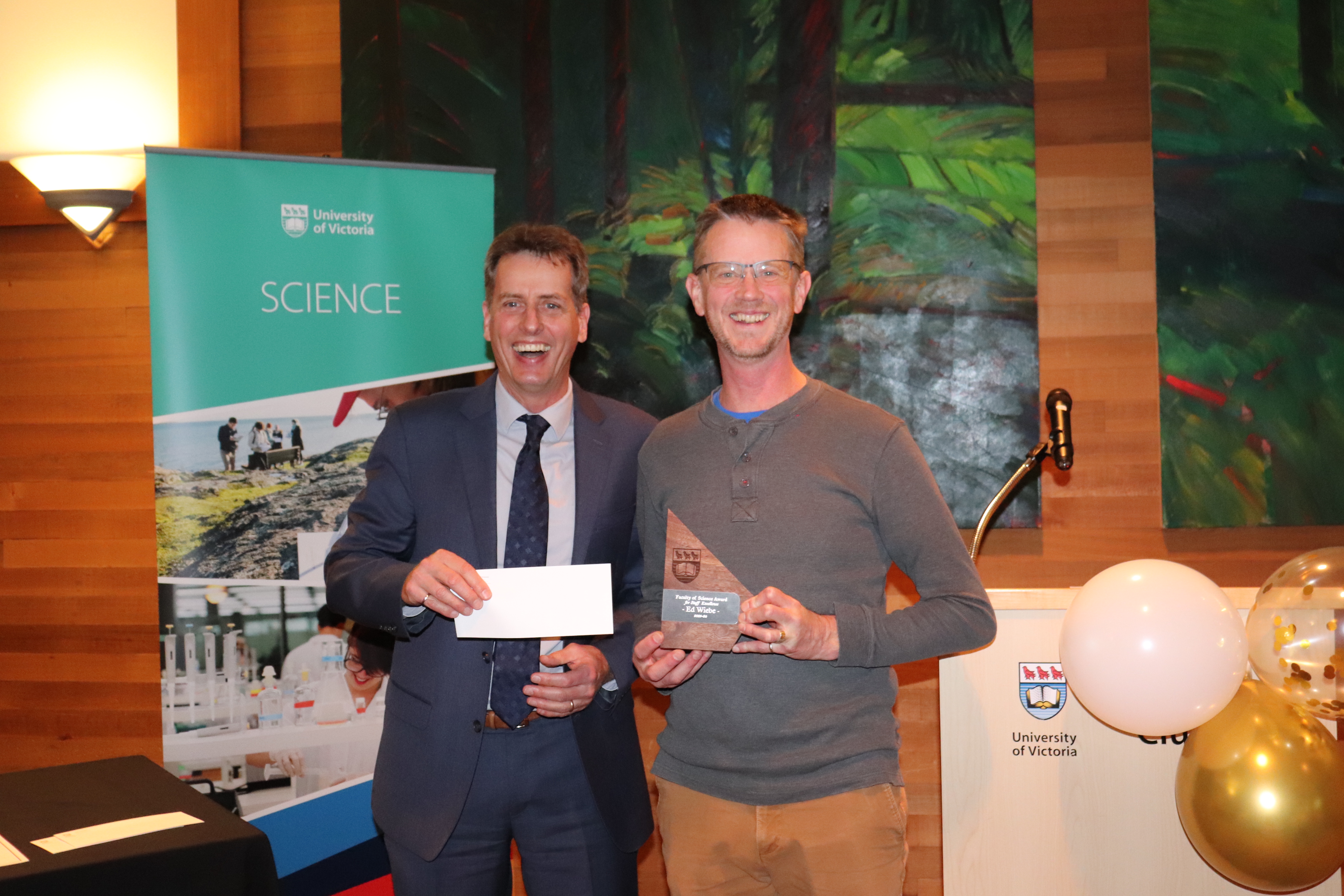 Ed Wiebe receiving his award from Dean of Science Peter Loock
