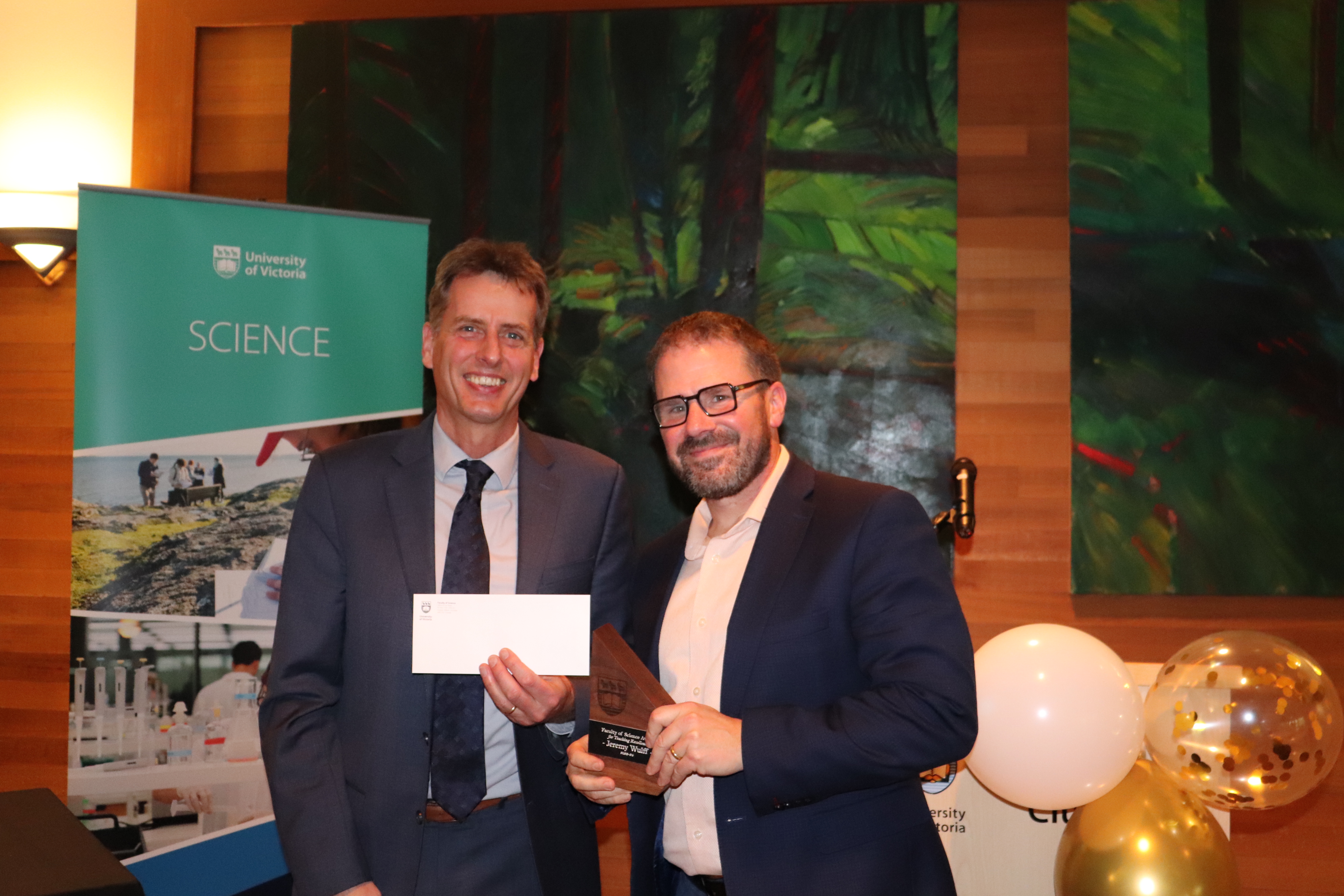 Jeremy Wulff receiving his award from Dean of Science Peter Loock