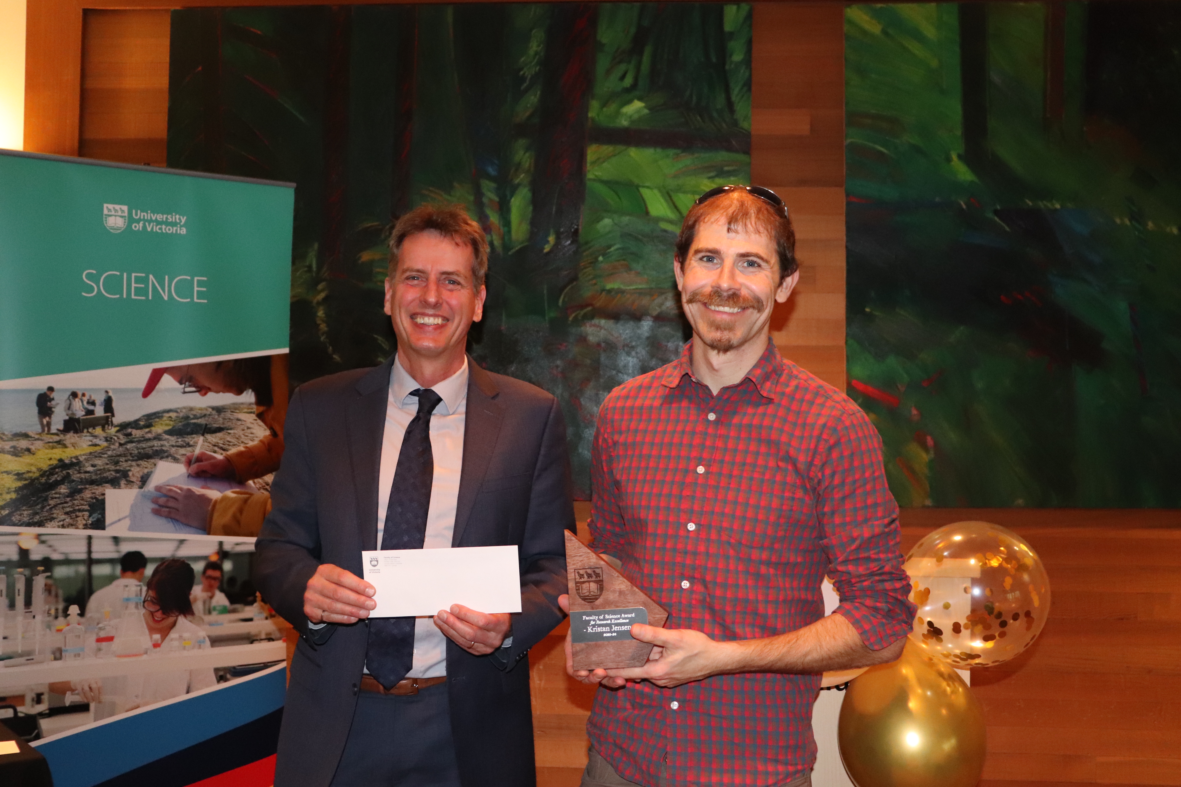 Kristan Jensen receiving his award from Dean of Science Peter Loock