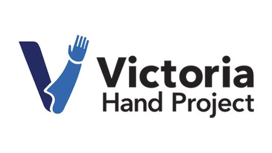 Logo of the Victoria Hand Project, displaying a visual description of a prosthetic arm in the shape of the letter "V"