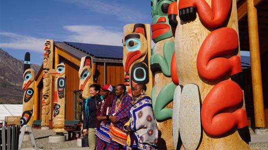 Group photo of UVic's UVic assistant professor Crystal Tremblay and a group of Indigenous (Maasai) leaders from Tanzania: Samwel Nangiria Taresero, Nalaimuta Oletutayo Makeseni and Mark Leshao Talash at Carcross-Tagish First Nations Cultural Centre during a 2019 two-day visit 