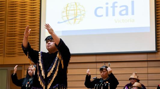 Photo of Lək̓ʷəŋən traditional dancers welcoming UN delegates and visitors at the opening reception and launch of CIFAL Victoria, First Peoples House, in March 2022