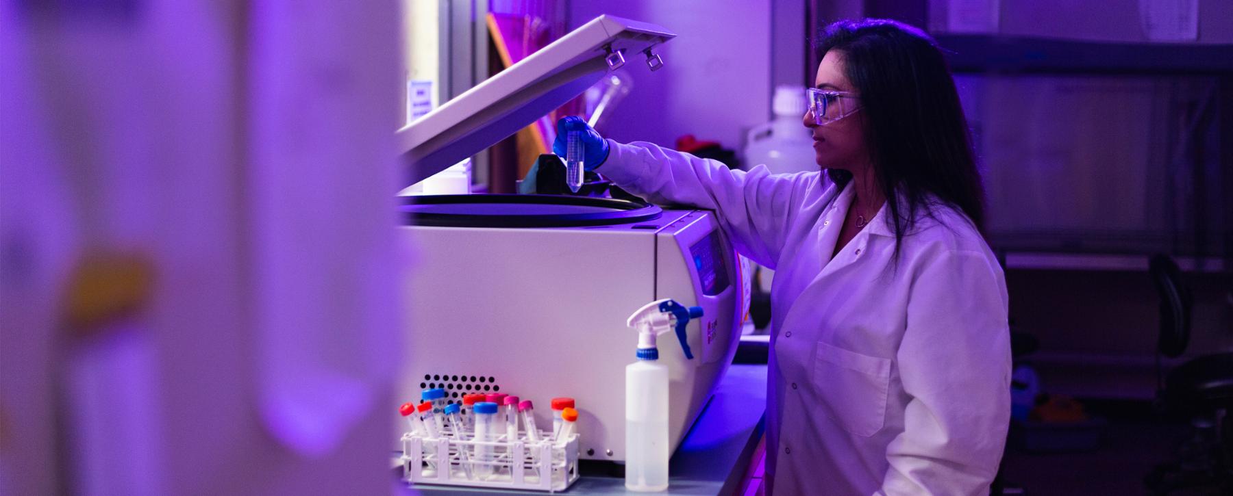 researcher using lab equipment