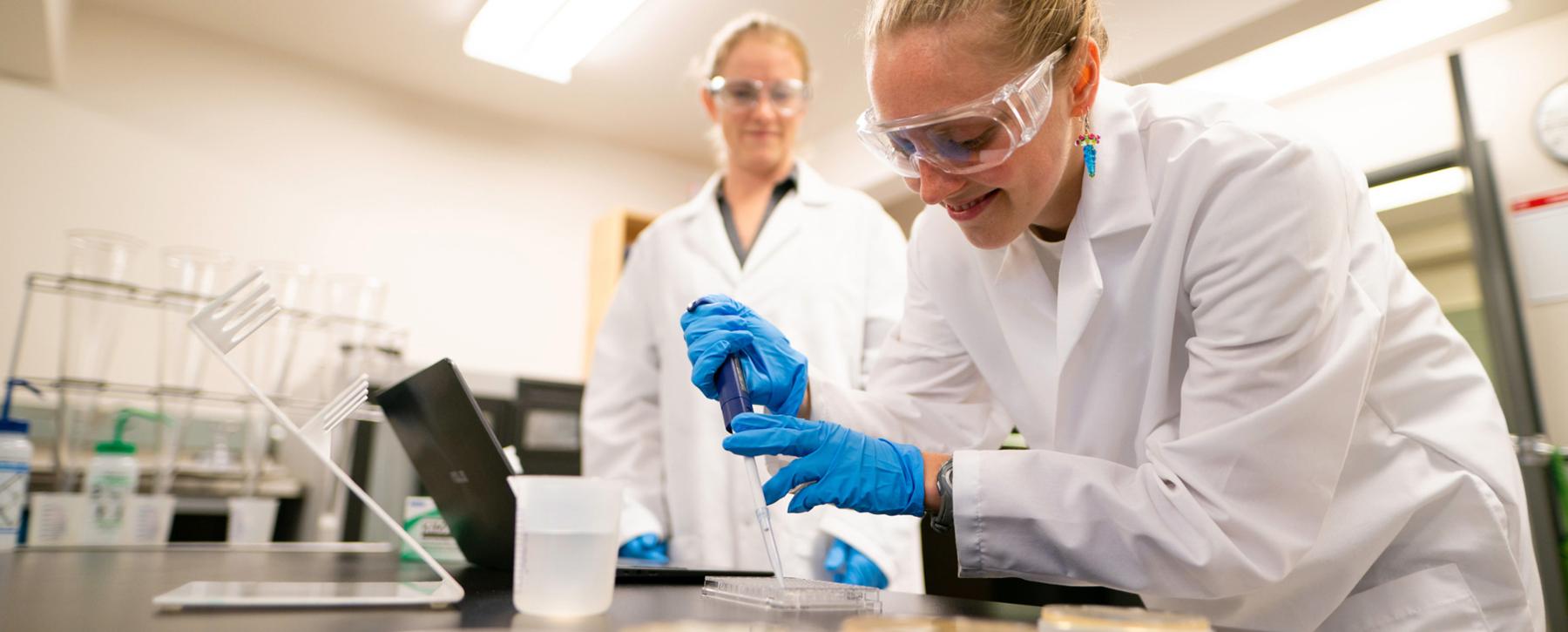 two students working in a lab