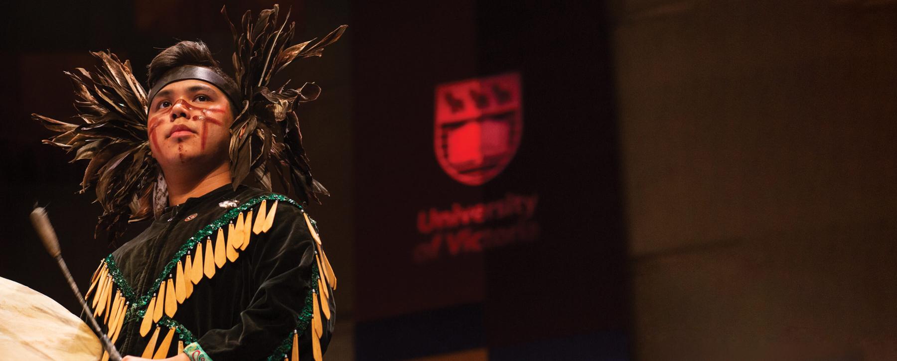 Songhees drummer Eugene Sam performs at a previous UVic convocation ceremony.