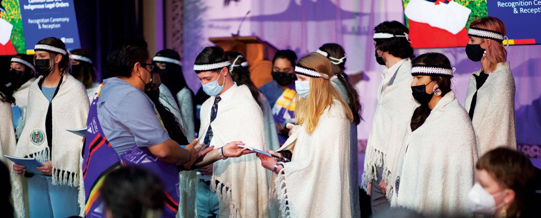 The first graduating class of the JID program onstage at UVic convocation