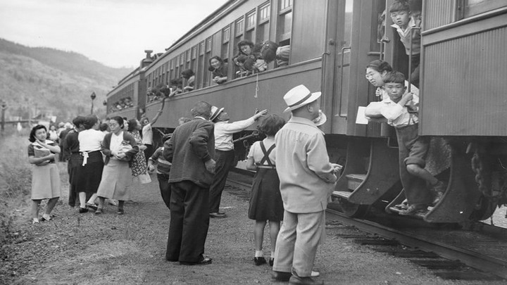 Displaced Japanese Canadians leaving the Vancouver area (possibly Slocan Valley) after being prohibited by law from entering a “protected area” within 100 miles of the coast in BC.
