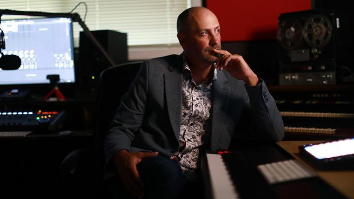 Associate University Librarian – Reconciliation Ry Moran sits in a chair in a recording studio.