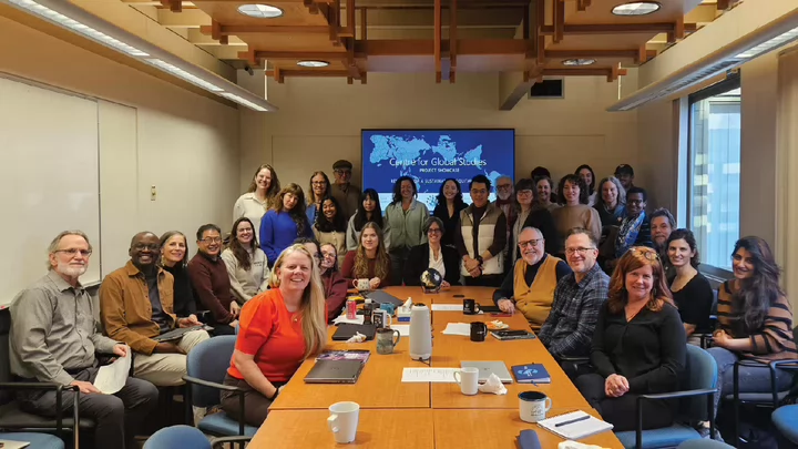 Photo of the fellows and members of the Centre for Global Studies gathering in the meeting room