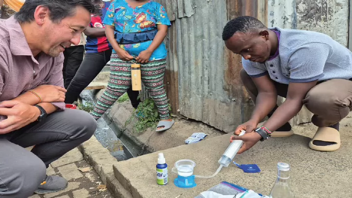 Photo of the PH2E Lab doing some community water testing
