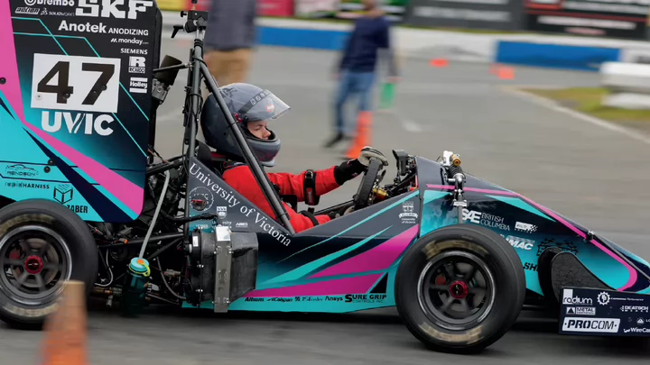 Close-up photo of the UVic Formula race car driven by a UVic student