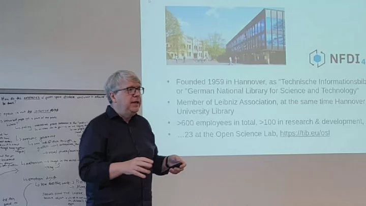 Photo of Dr. Lambert Heller giving a lecture at Kula Academy