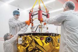 Students work on the NASA CAPSTONE spacecraft integration.