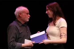 El receiving the Spirit of the Phoenix Award from directing professor Peter McGuire.