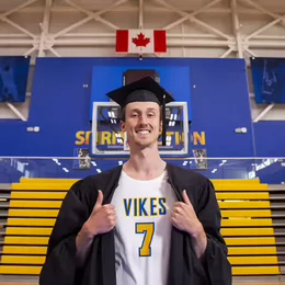 Vikes grad Ethan Boag in regalia and uniform.