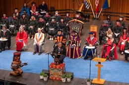 UVic convocation ceremony stage with designees in full regalia