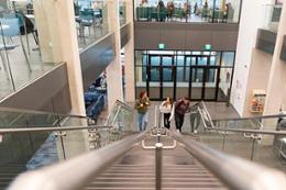 students walk up the stairs at the Cove