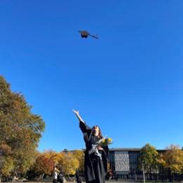 grad throwing cap in the air 