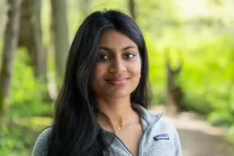 Jaanvi Garodia in a forested background.