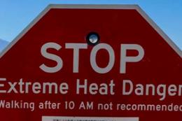 A stop sign warning about extreme hot weather.