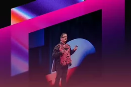 A man stands on a stage and presents.
