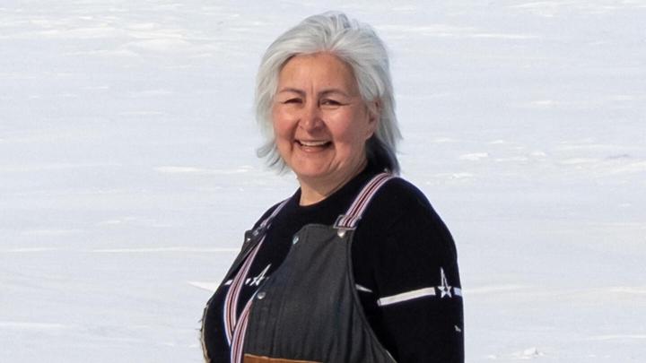 Maureen Gruben smiling and standing on snow