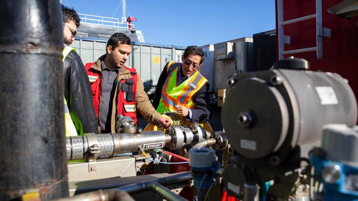 researcher observing marine equipment