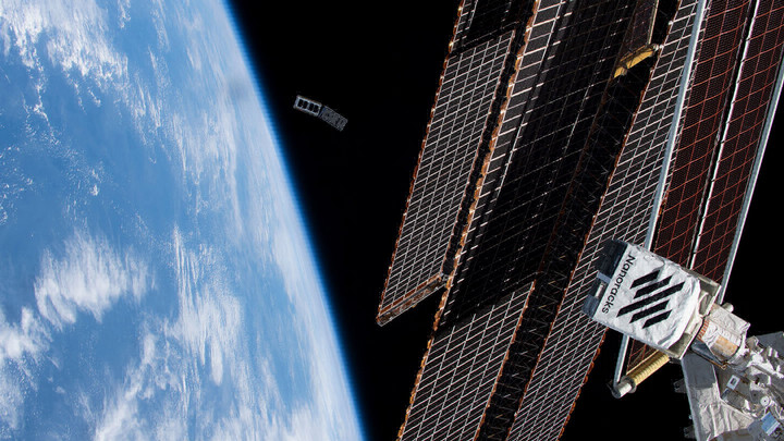 a cube satellite is deployed in orbit above earth