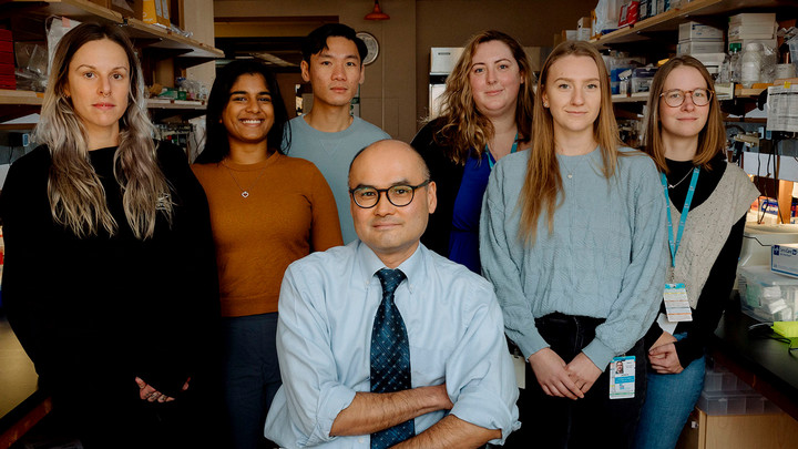 Julian Lum and students in lab