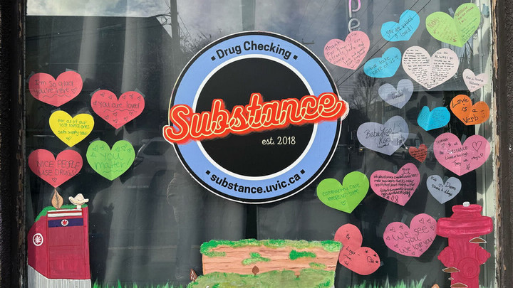 The window of substance featuring their logo and hearts with messages of support to the community