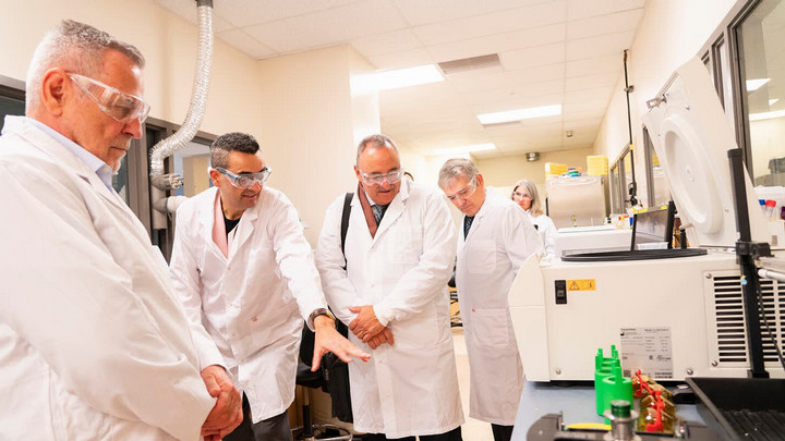 CFI President Sylvain Charbonneau and Pierre Normand in the UVic Health Core lab facility