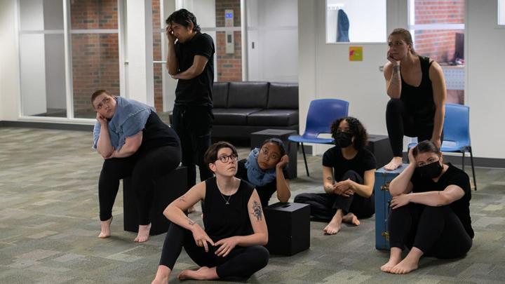 Cast of play performing