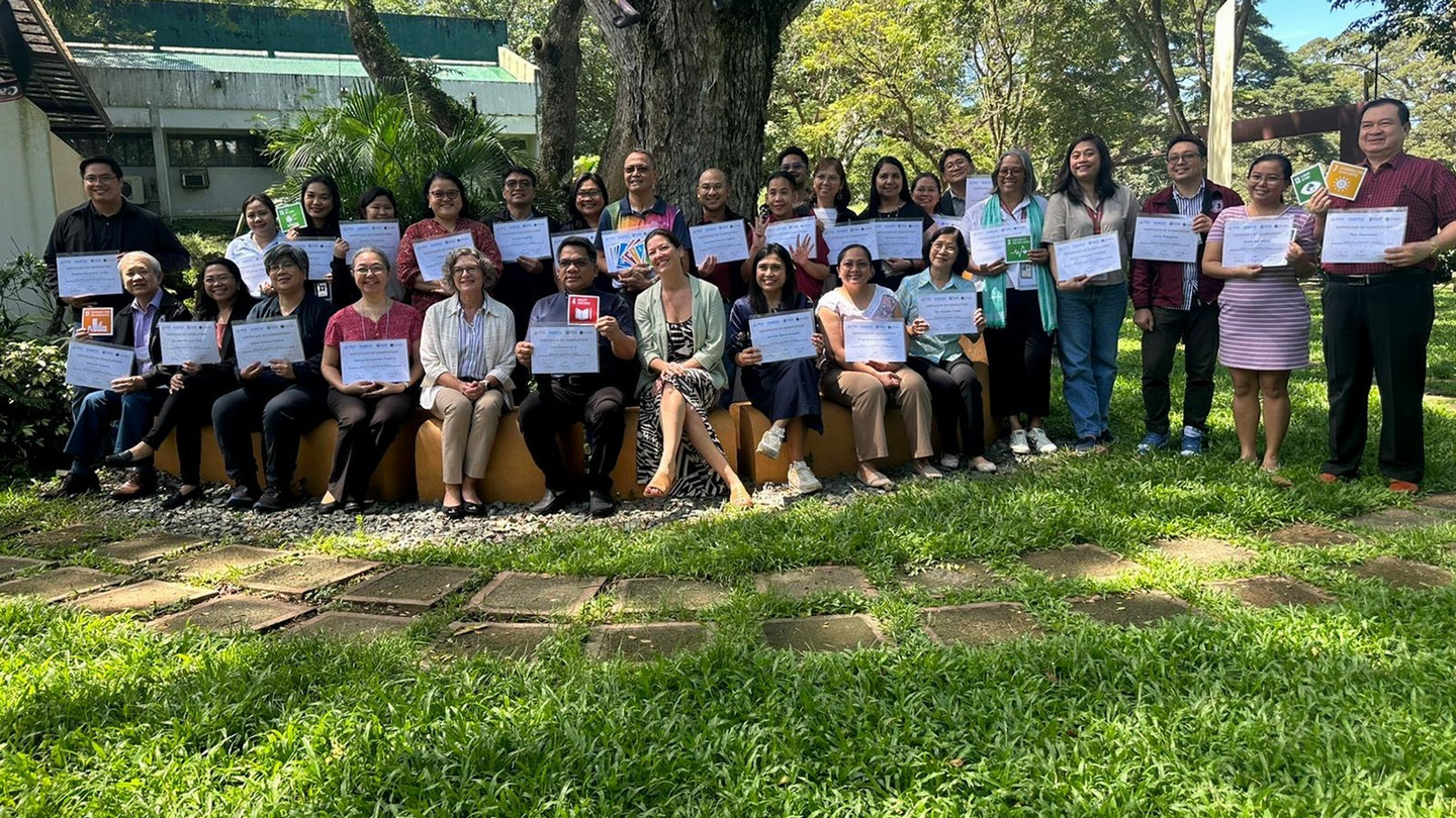 Executives at University of the Philippines with certificates for completing CIFAL's original training course.