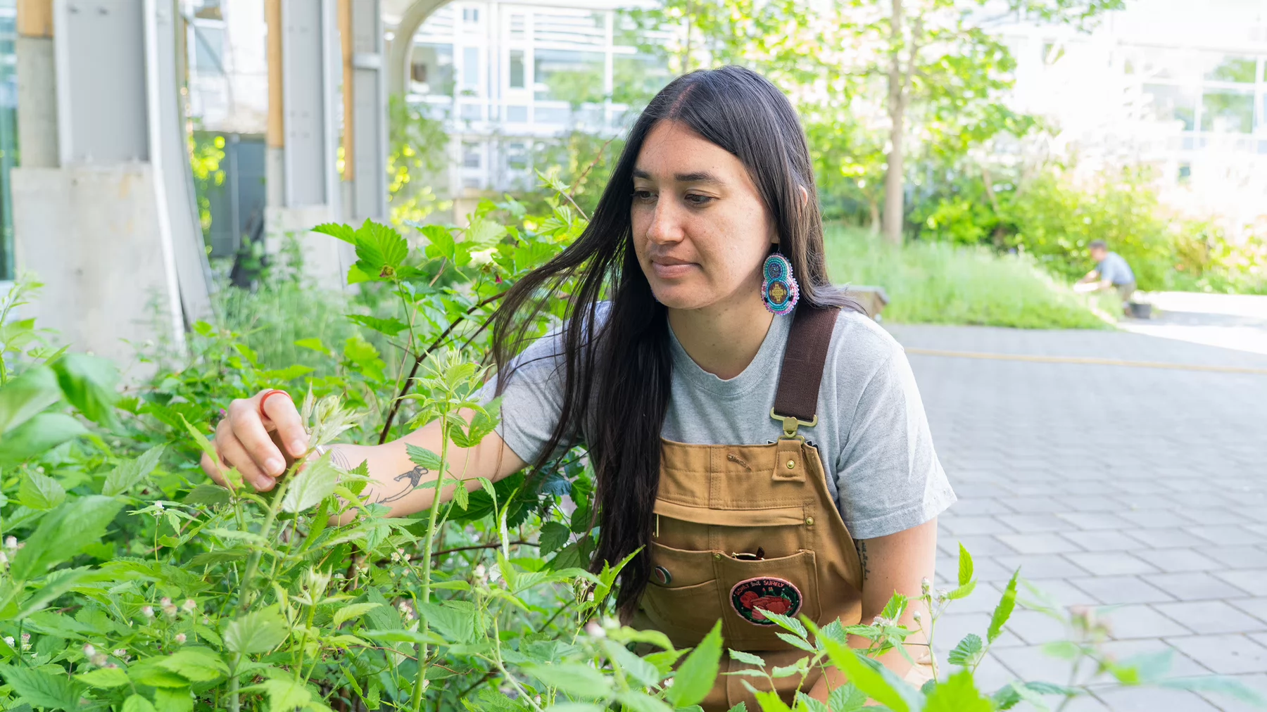 Loreisa Lepine with a Blackcap Raspberry plant.
