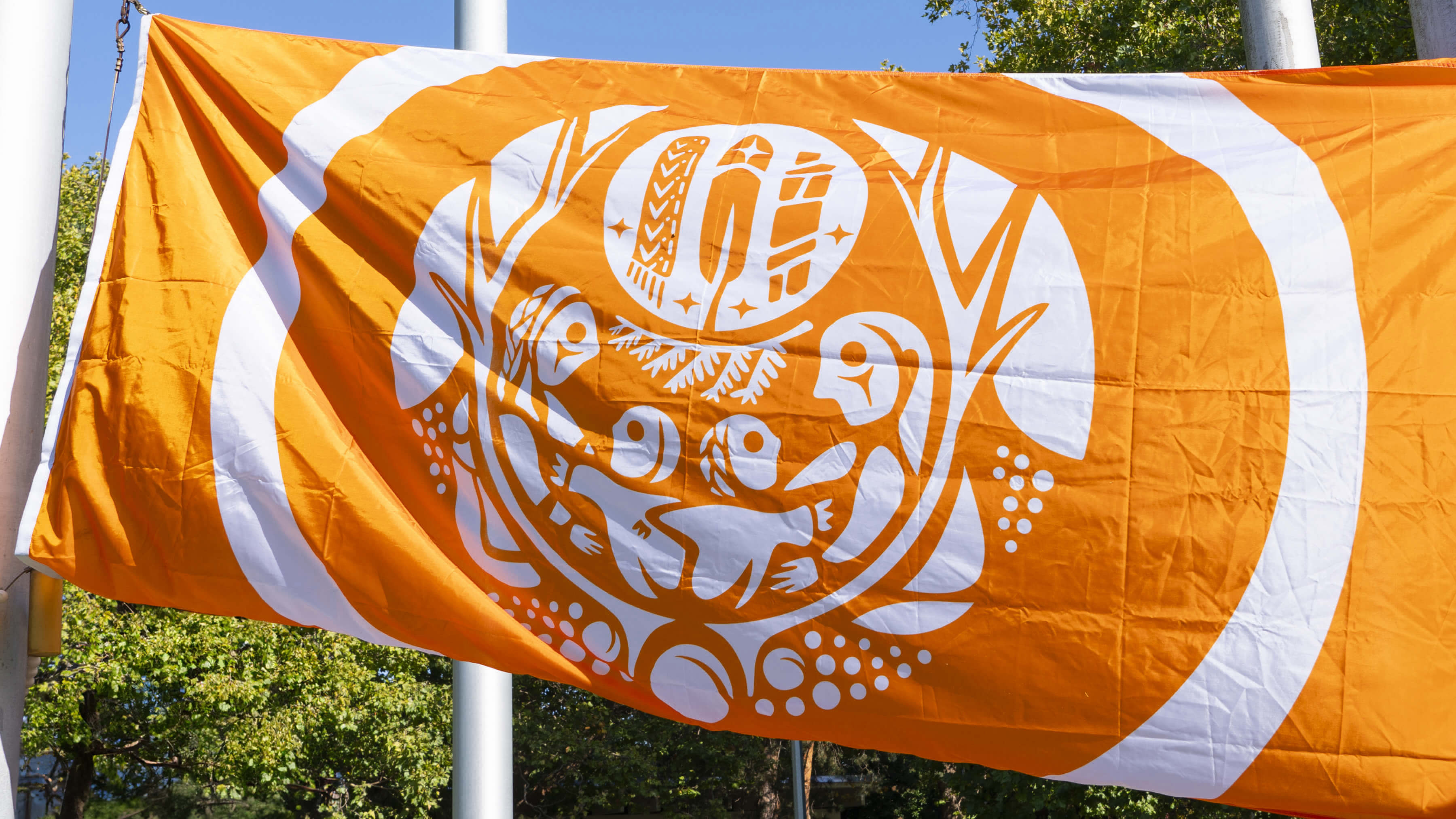 Raising of the Survivor's flag in the quad at Orange Shirt Day.