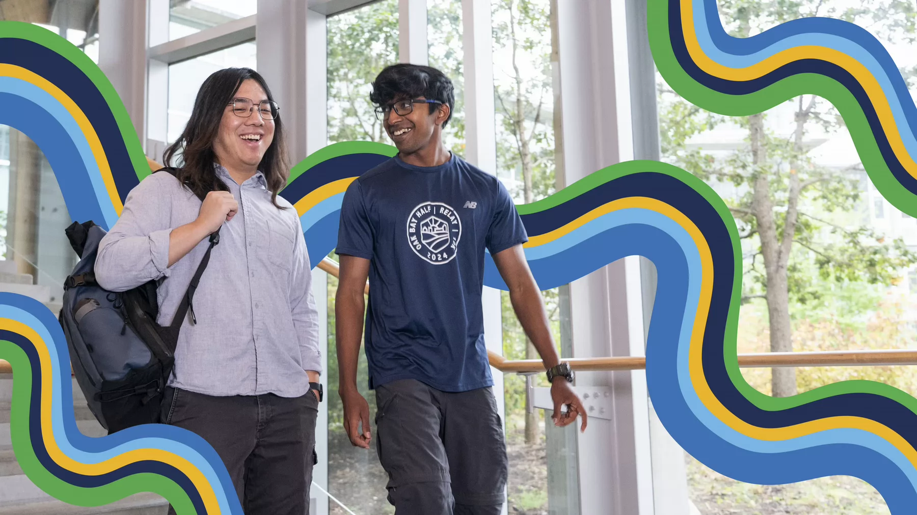Two smiling students surrounded by colourful illustrated swirls. 