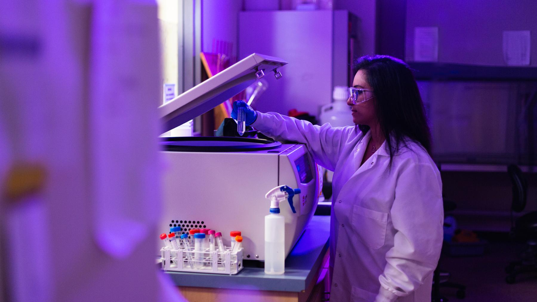 researcher in lab using equipment