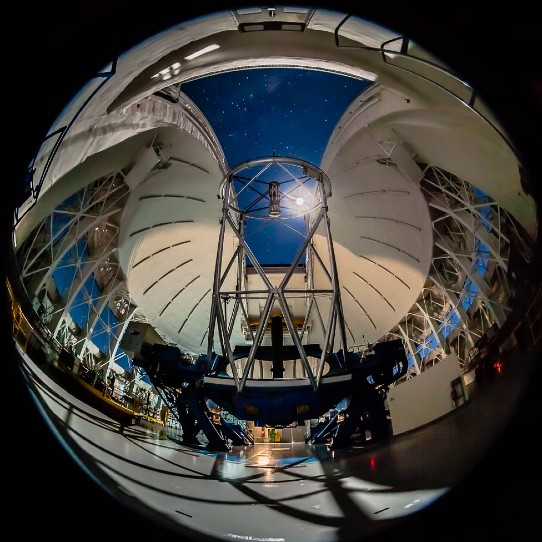 Taken with a fish-eye lens from inside the Gemini South dome shows the moon in the night sky.