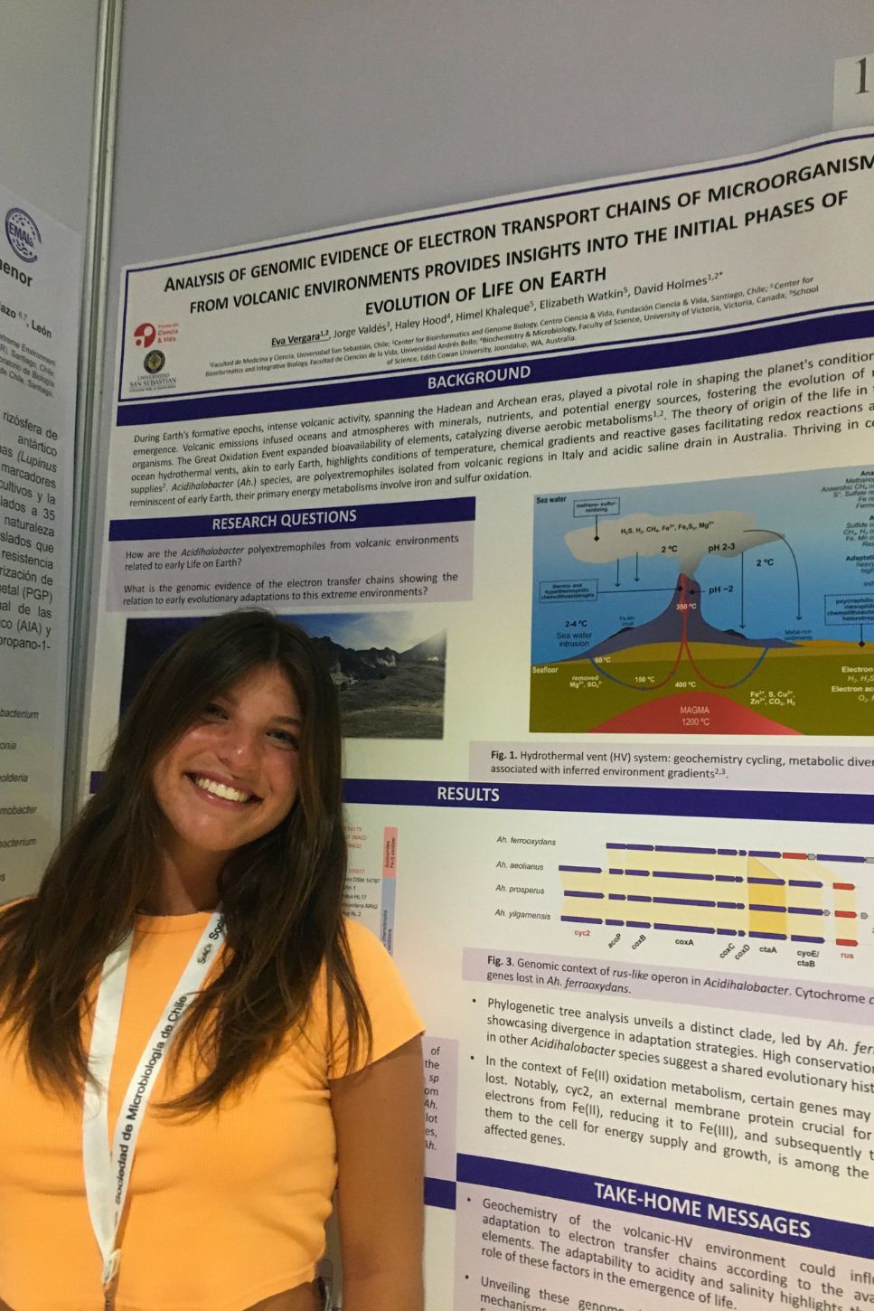 A woman standing in front of a conference poster