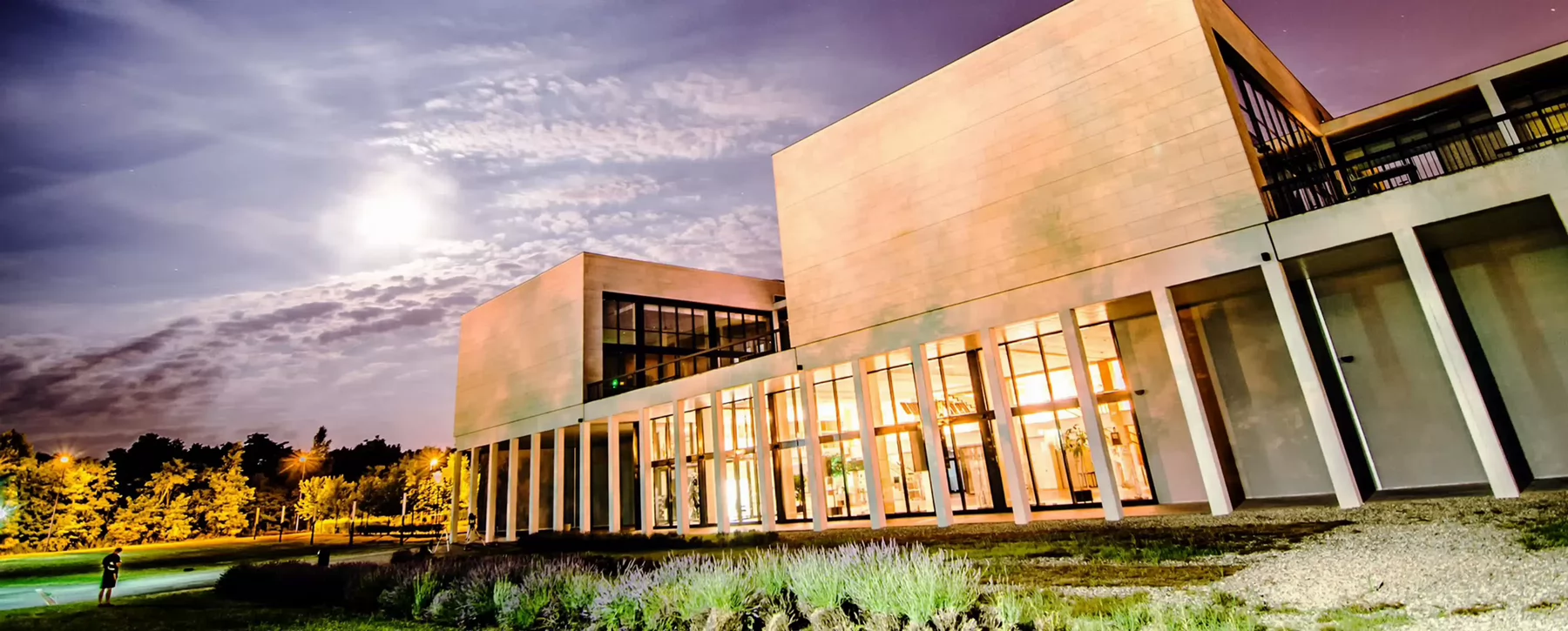 University building under the night sky.