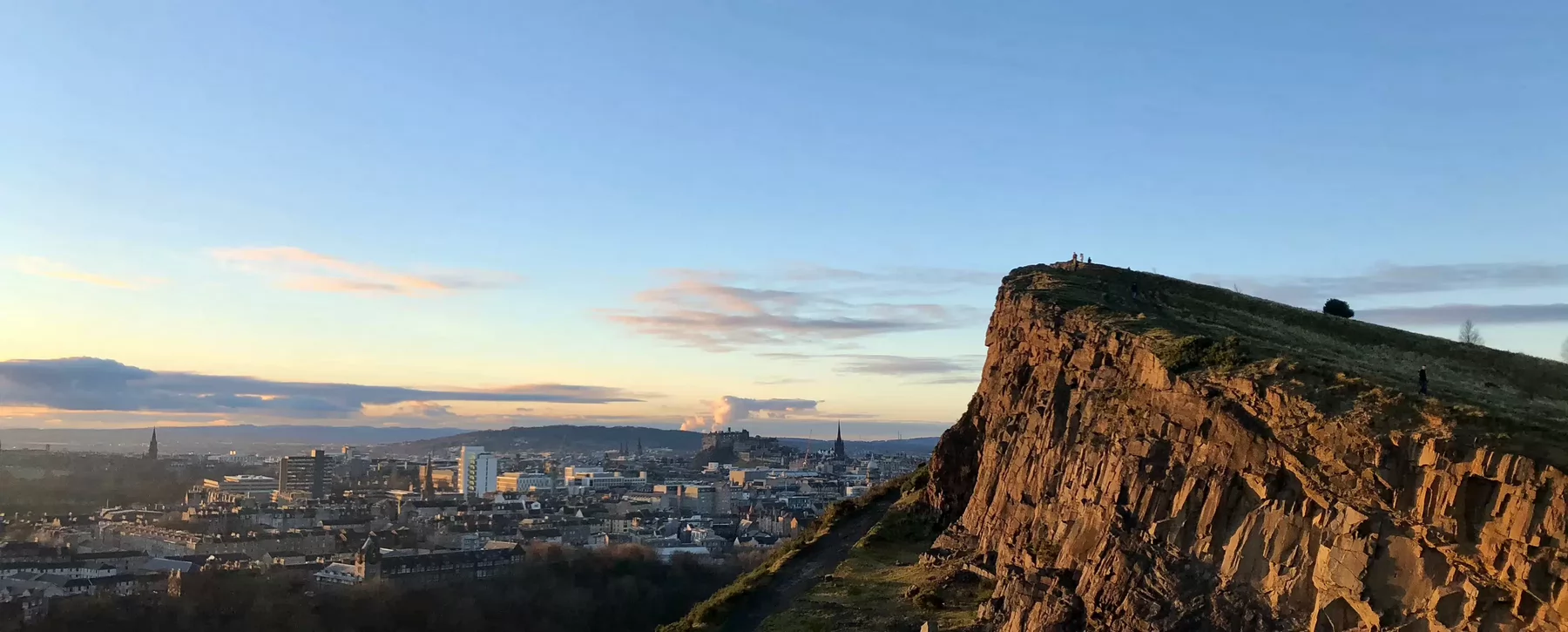 View of a city and adjacent hill. 