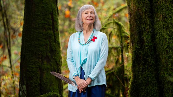 Marion Buller standing in a forest