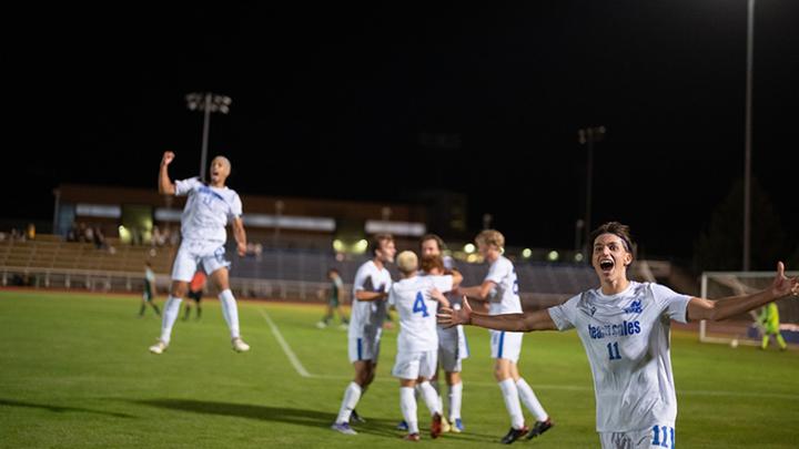 Vikes soccer players celebrating a goal