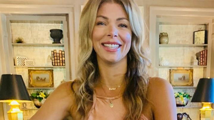 Woman with long blonde hair smiling.