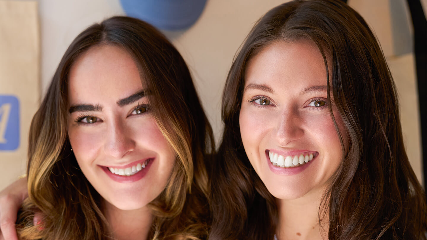 Two women smiling.